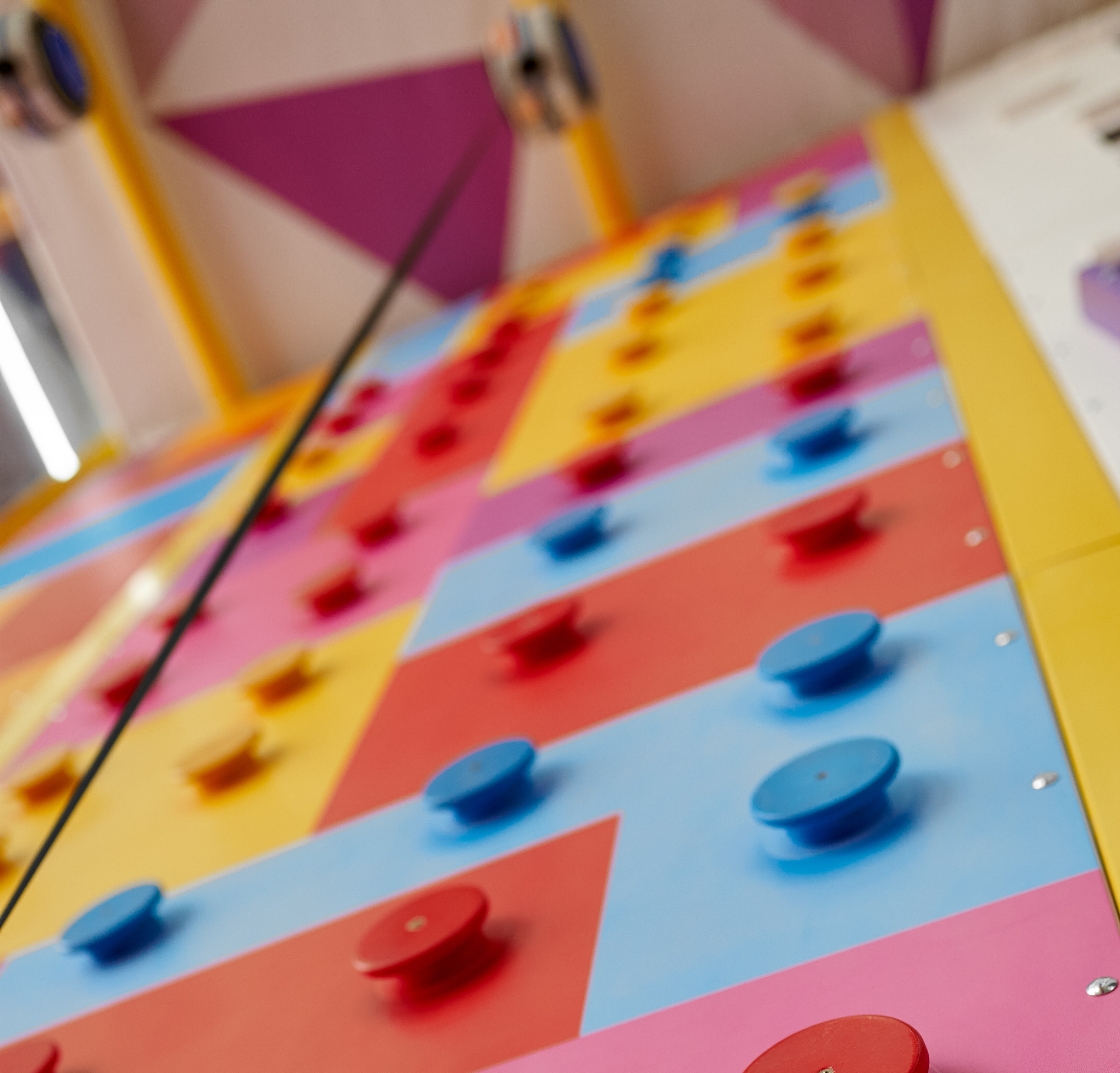 Climbing wall playground interior, entertainment center. Area for climbers trainings, active sport for children and youth